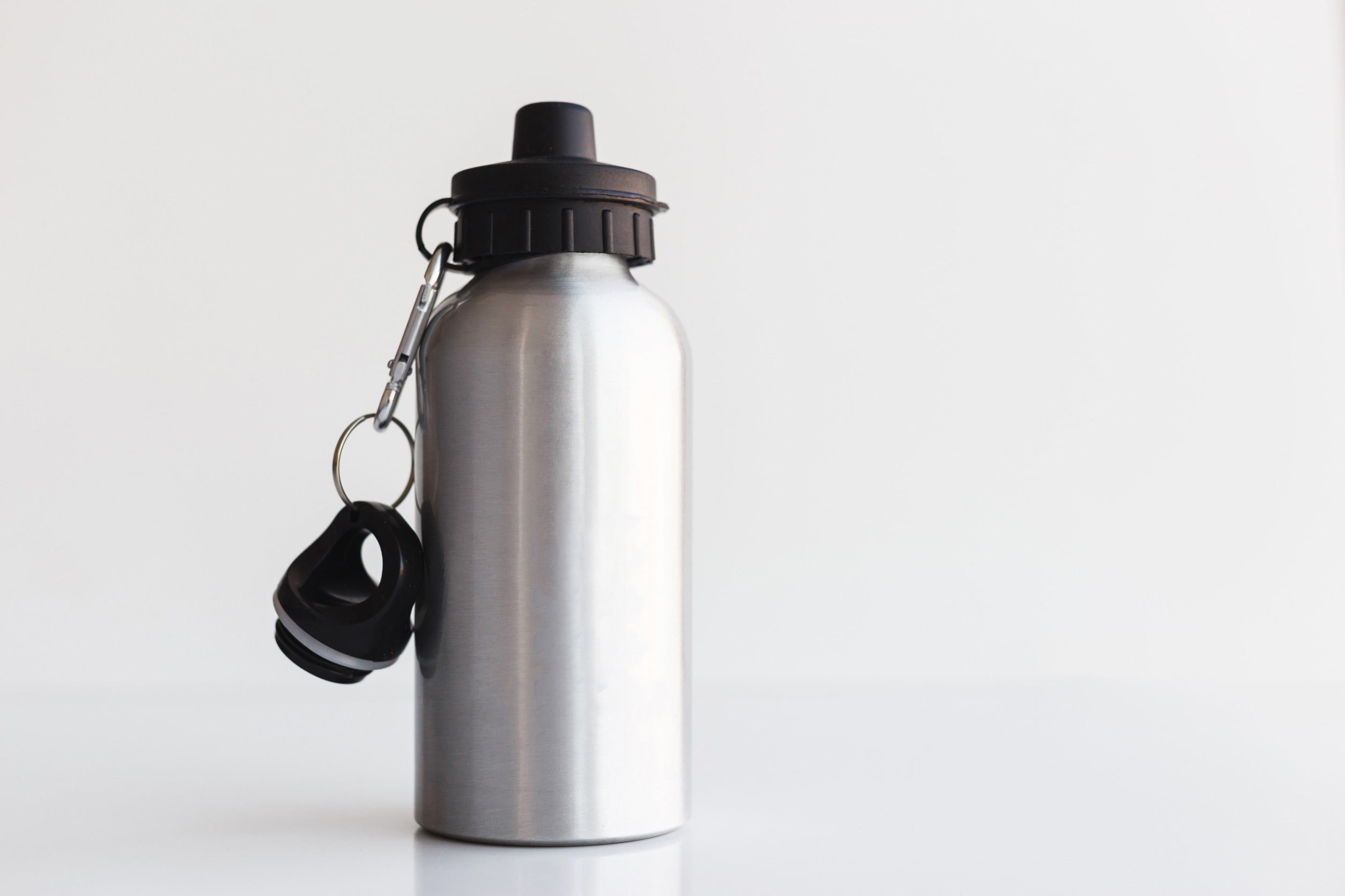 Silver metal water bottle against a white background