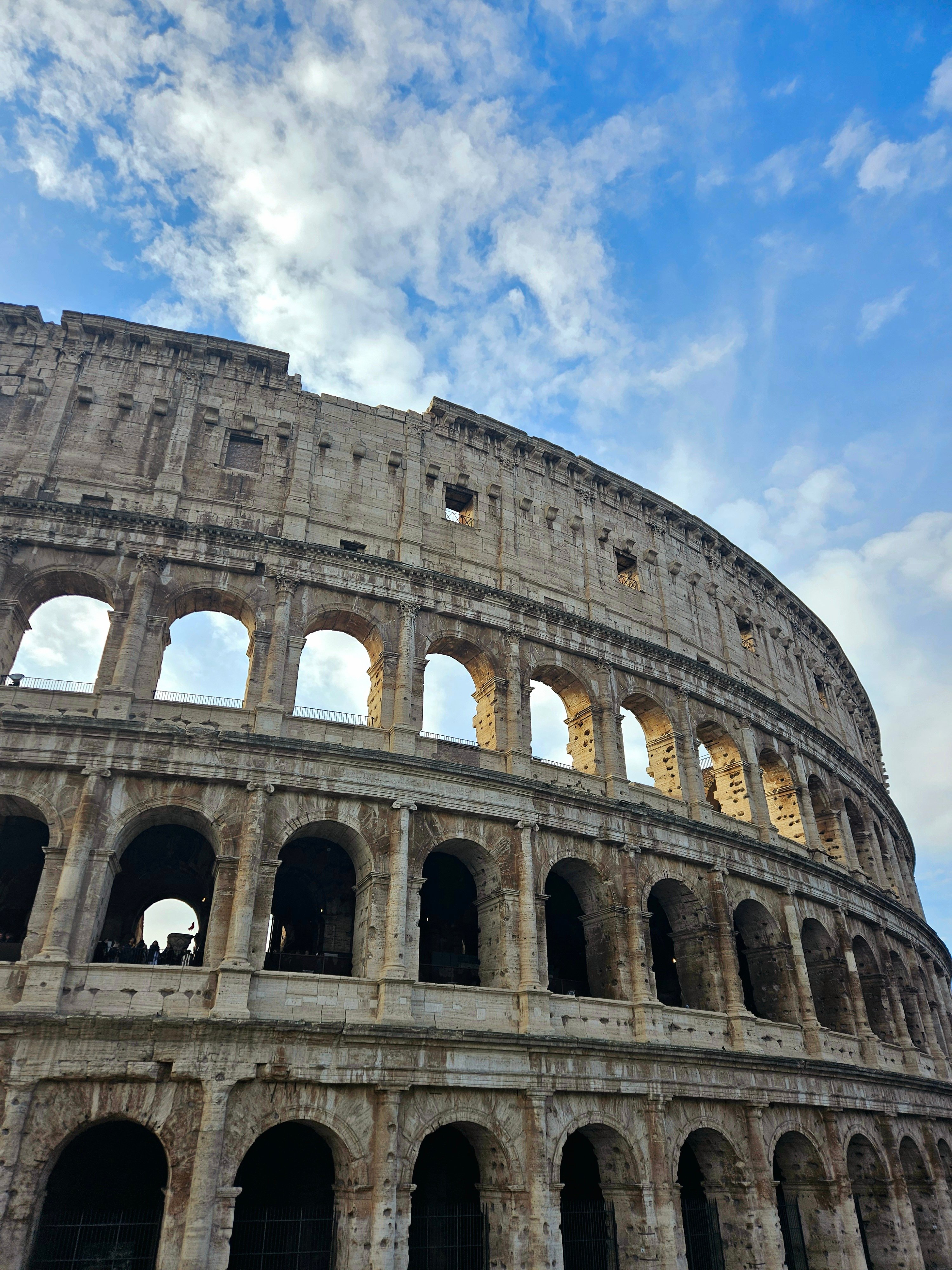 Close up of the Colosseum up against a blue sky in Rome